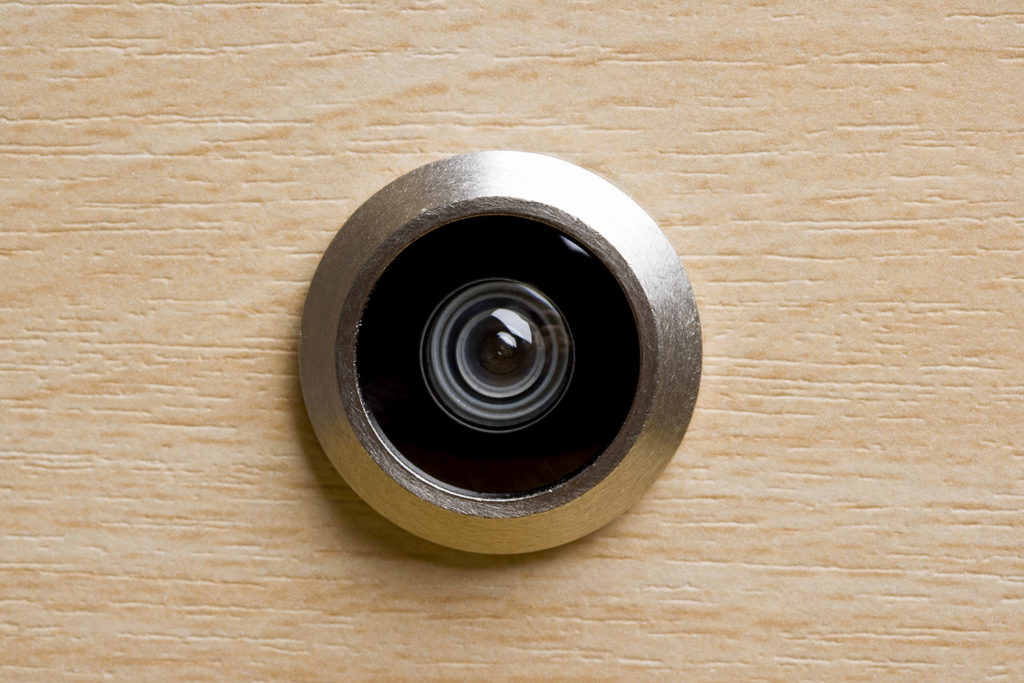 Door peephole, extreme close-up